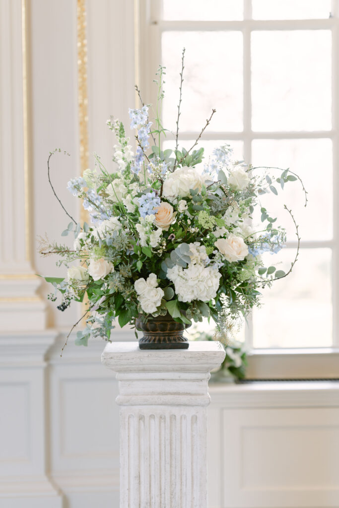 A winter seasonal floral arrangement featuring hydrangea, hellebores, eucalyptus, roses and anemones.